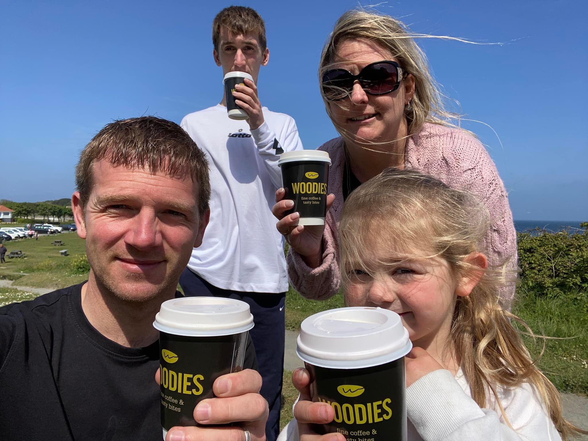 Family enjoying coffee together while running a flexible online business from anywhere.